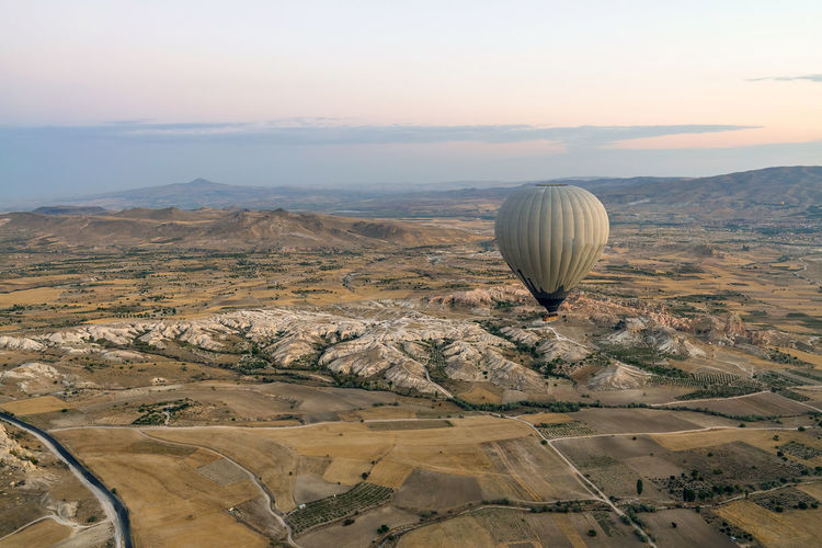 Wide panorama of cappadocia landscape colored balloons flying over mountain peaks and love valley. 
