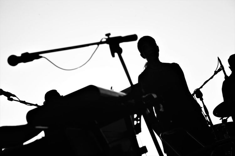 Low angle view of silhouette man against clear sky