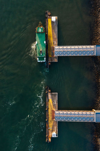 High angle view of boat and metal structure in river