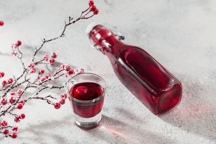 Homemade infused vodka, tincture or liqueur of red cherry