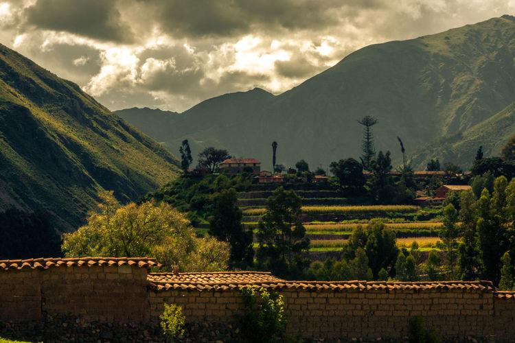 Sacred valley of the incas - scenic view of trees and mountains against sky