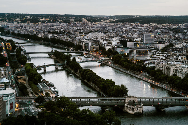 High angle view of bridge over river and buildings in city