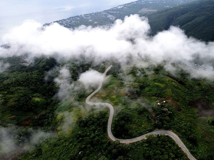 High angle view of mountain road in forest