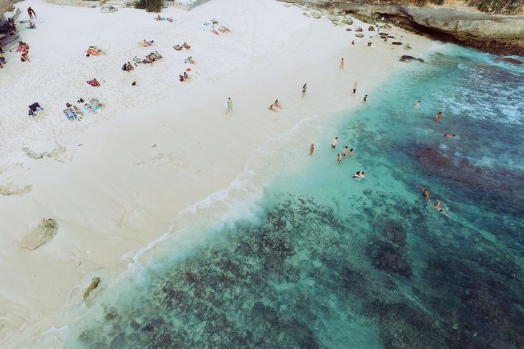 Aerial view of people enjoying at seaside