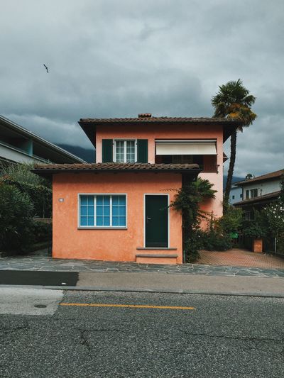 Street by building against sky