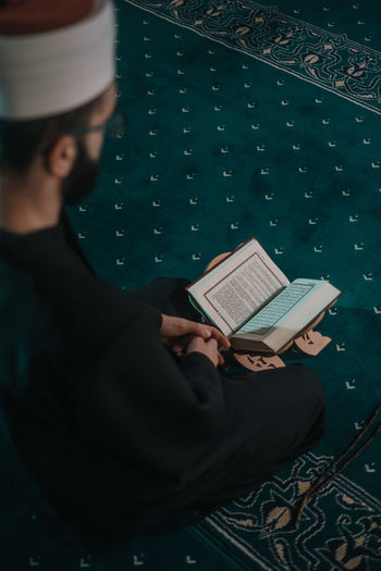 High angle view of man reading book