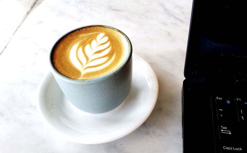 High angle view of cappuccino on table