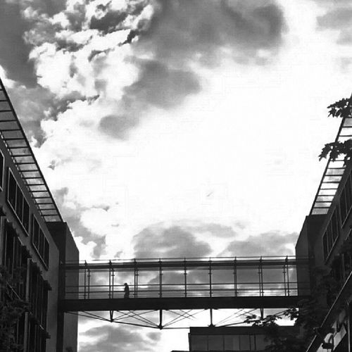 Low angle view of building against cloudy sky