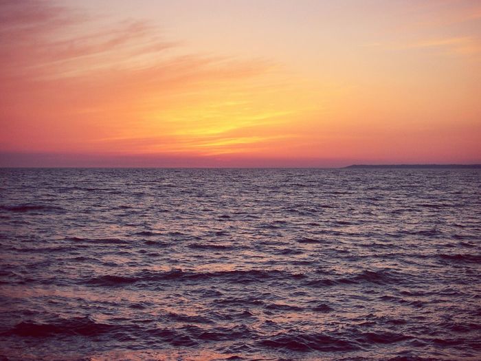 Scenic view of sea at sunset