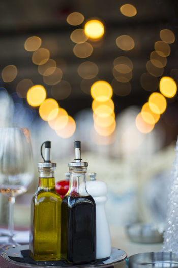 Close-up of illuminated bottles on table