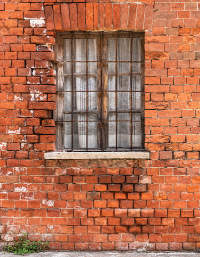 Full frame shot of window on brick wall of building
