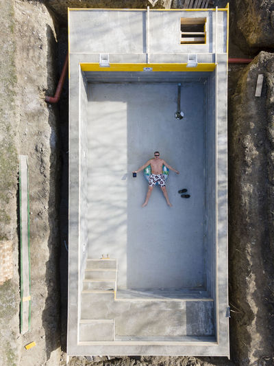 High angle view of man on wall of building