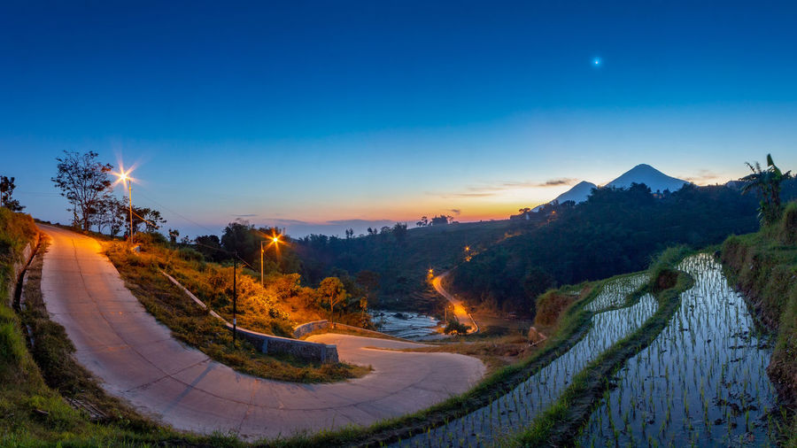 Panoramic view of landscape against clear sky at night