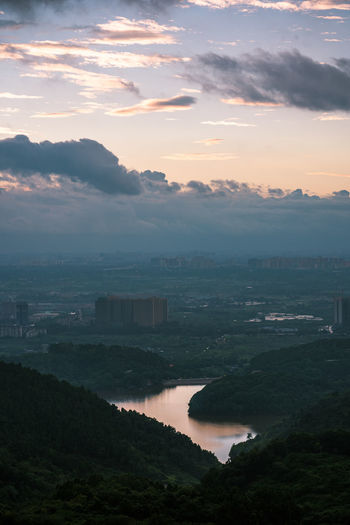 High angle view of river against sky at sunset