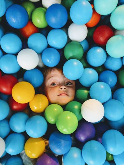 High angle portrait of boy in ball pool