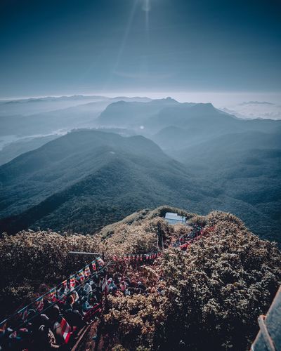 High angle view of crowd on mountain against sky
