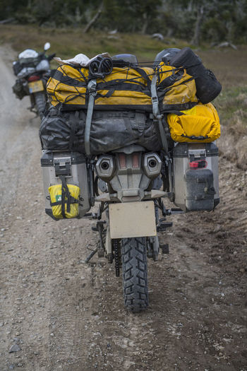Rear view of yellow motorcycle on road