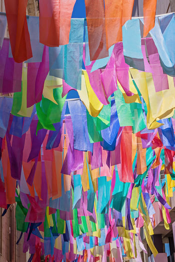 Full frame shot of multi colored buntings hanging in city