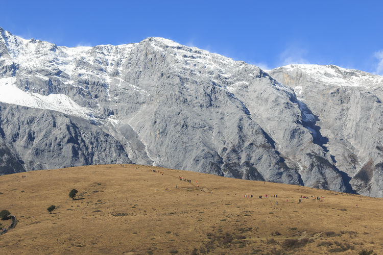 Scenic view of jade dragon snow mountain against sky
