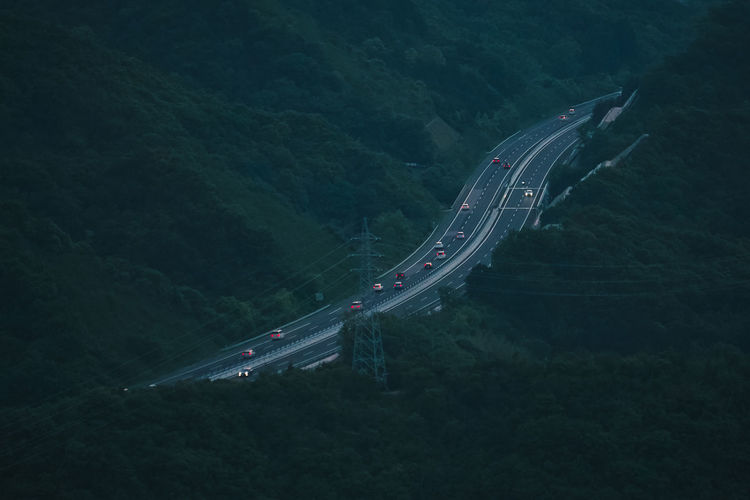 High angle view of road amidst plants and trees
