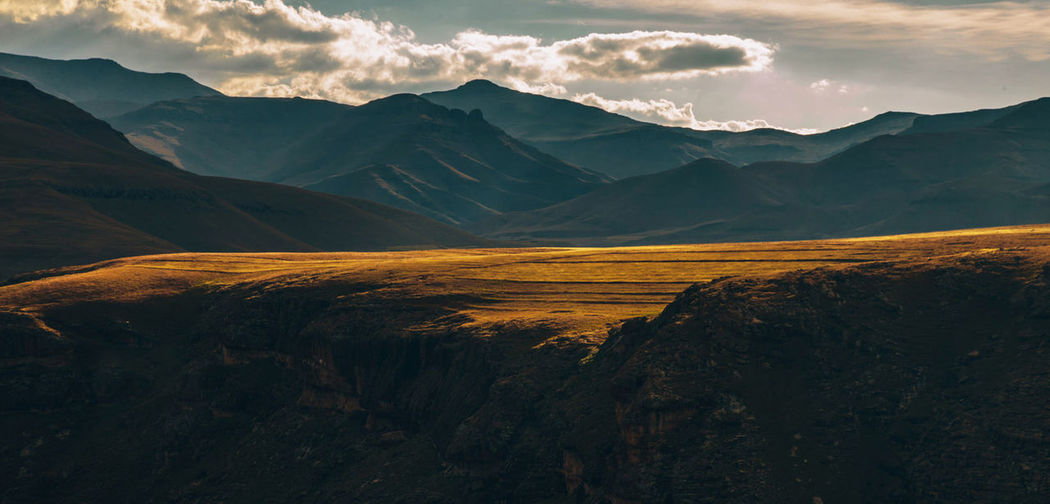 Scenic view of mountains against sky during sunset