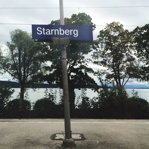 Low angle view of road sign against sky