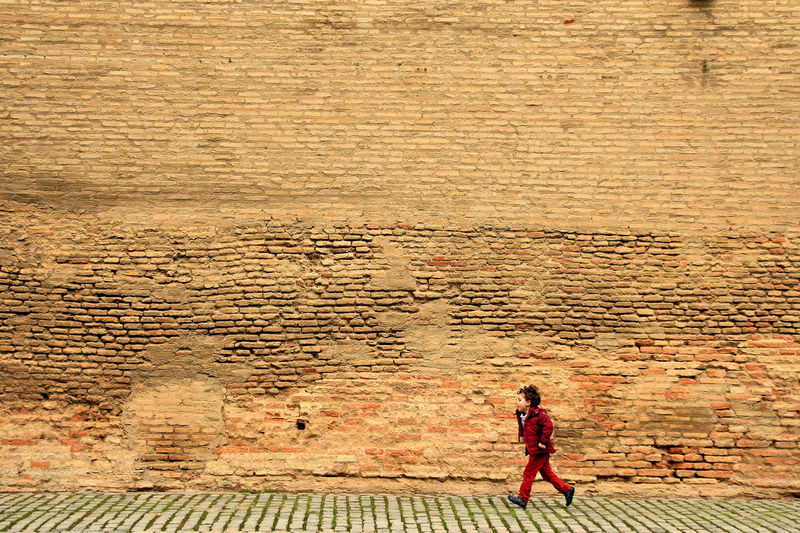 A boy running on a wall