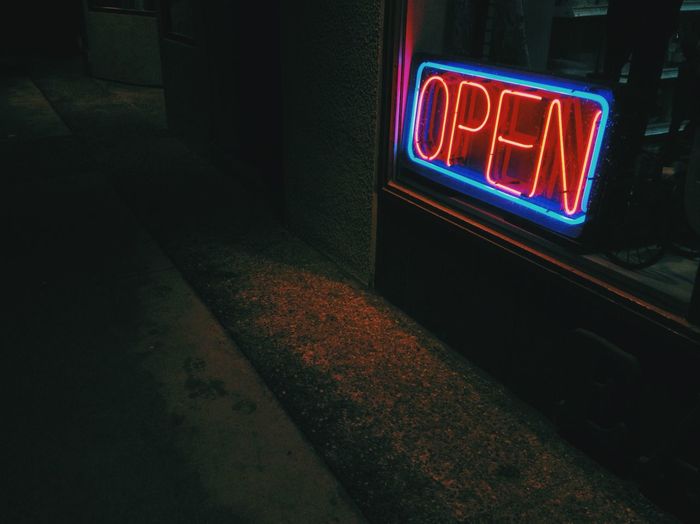 Close-up of glowing open sign