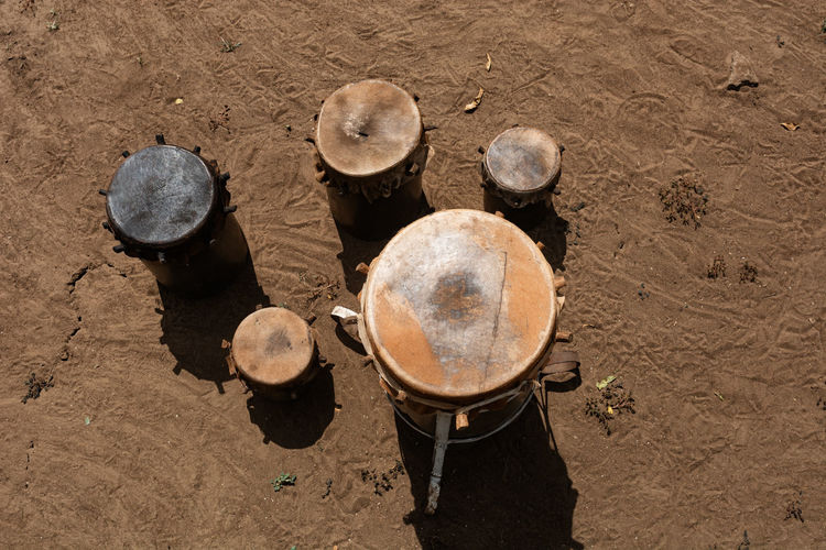 African handmade animal skin drums put on the sunlight to dry.