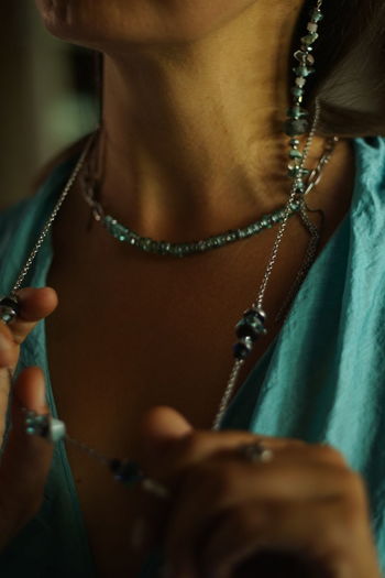 Midsection of woman holding hands