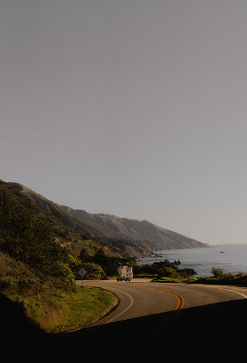 Scenic view on california big sur coast of camper vehicle parked on coast