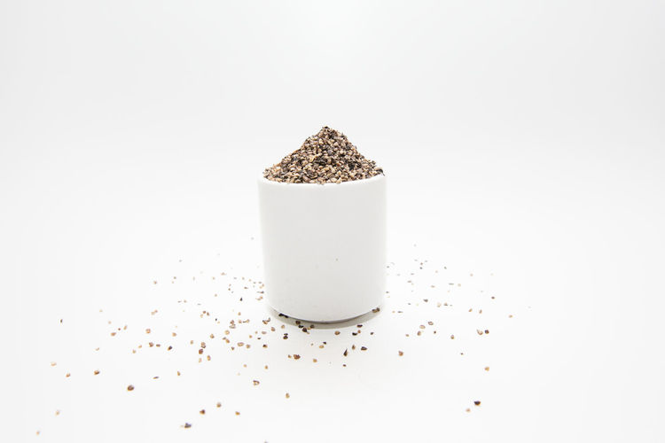 High angle view of coffee on table against white background