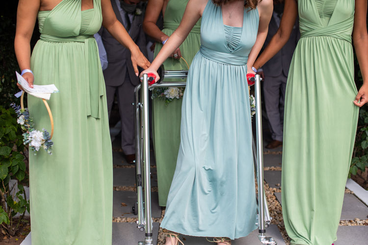 Bridesmaid walking in unison during event