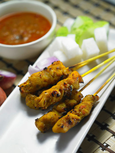 Malaysia famous street food ,grill satay chicken with sweet peanut curry sauce