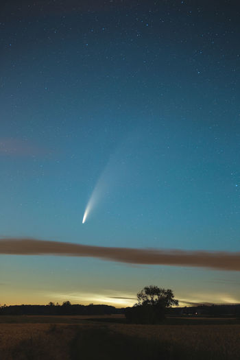 Neowise comet with noctilucent clouds under it.