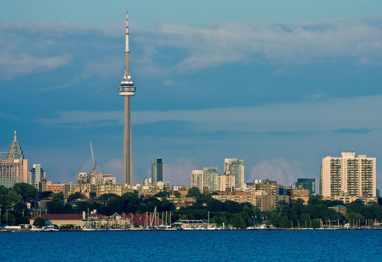 Toronto city skyline against sky featuring cn tower