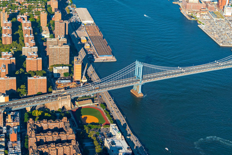 High angle view of bridge over river against buildings