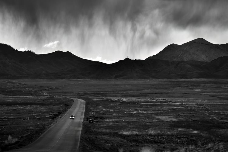The winding mountain roads around sailimu lake are beautiful