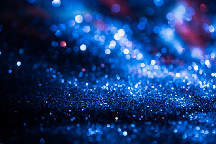 Defocused image of blue glitter