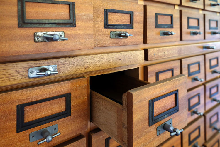 Close-up of wooden drawers used for archiving