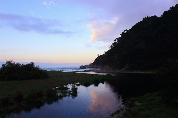 Scenic view of sea against sky at sunset
