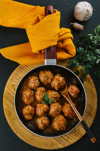 Pan with hot homemade meatball stew seasoned with spices for flavor