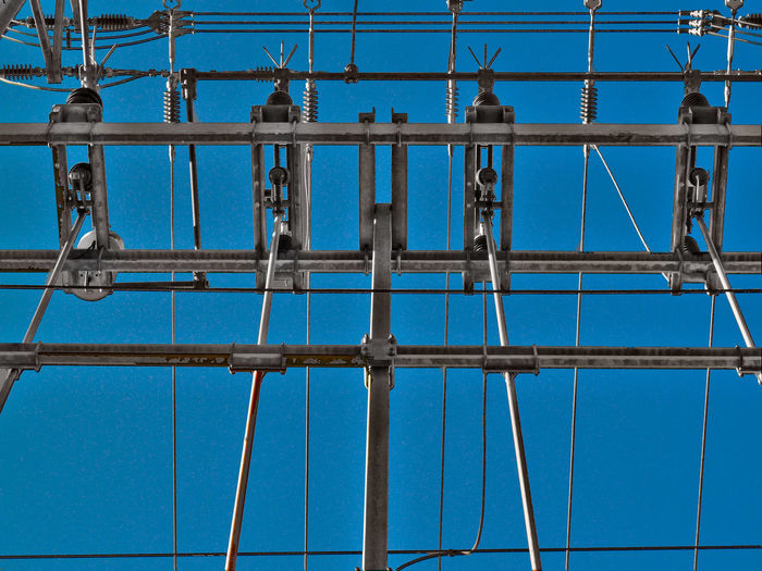 Full frame shot of electricity pylon against clear sky
