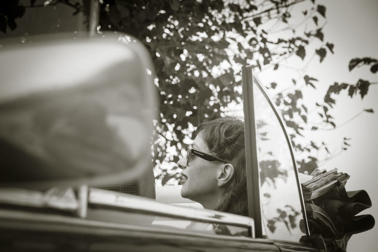 Woman in convertible car