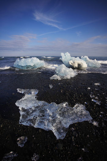 Stranded icebergs on black sand beach in south east iceland