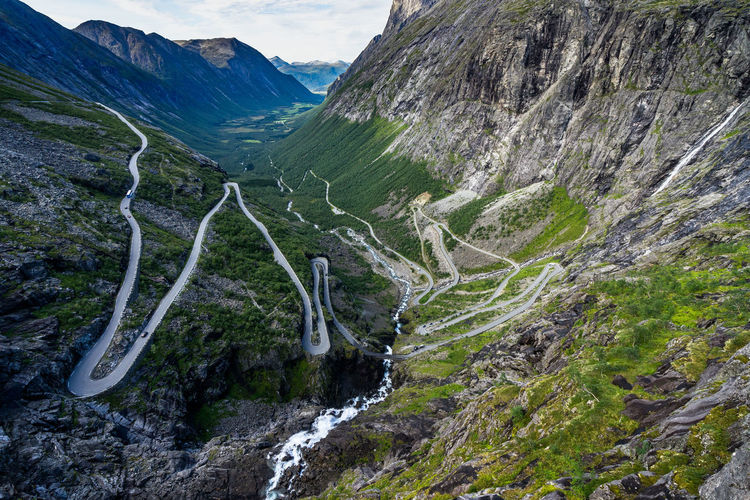Scenic view of road amidst mountains
