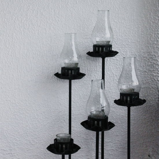 Close-up of illuminated oil lamps