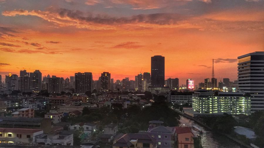 High angle view of buildings against sky during sunset