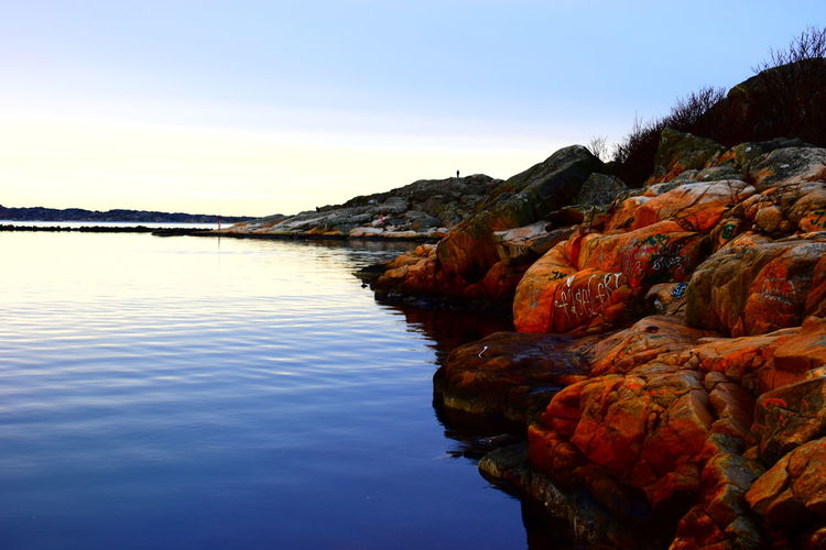Scenic view of lake against blue sky