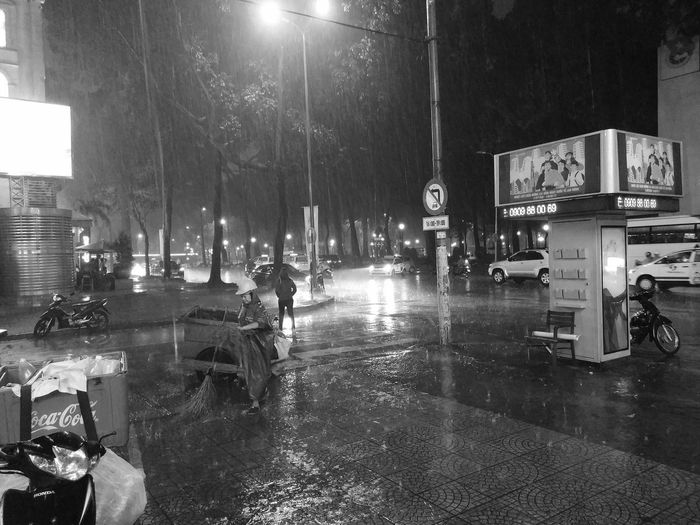Wet street in city during rainy season at night